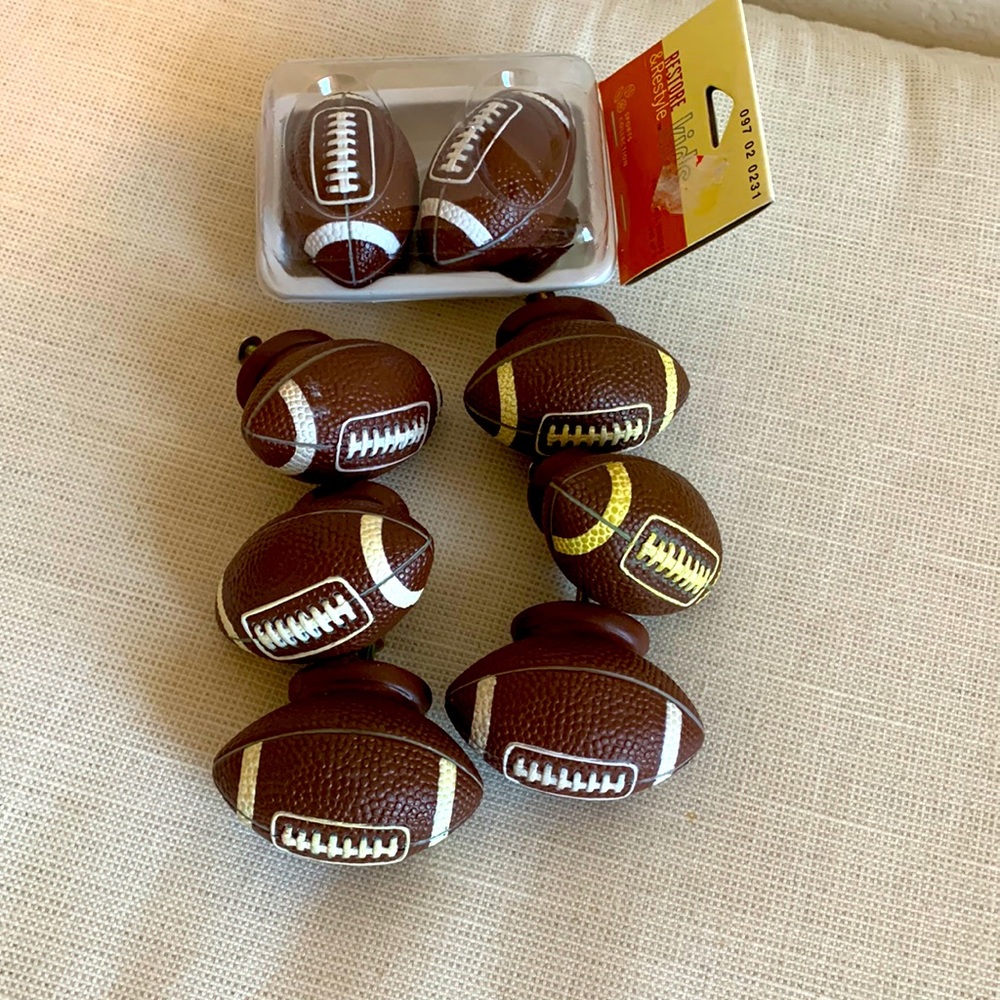 Set of 8 football drawer pulls and set of 2 football wall pegs.